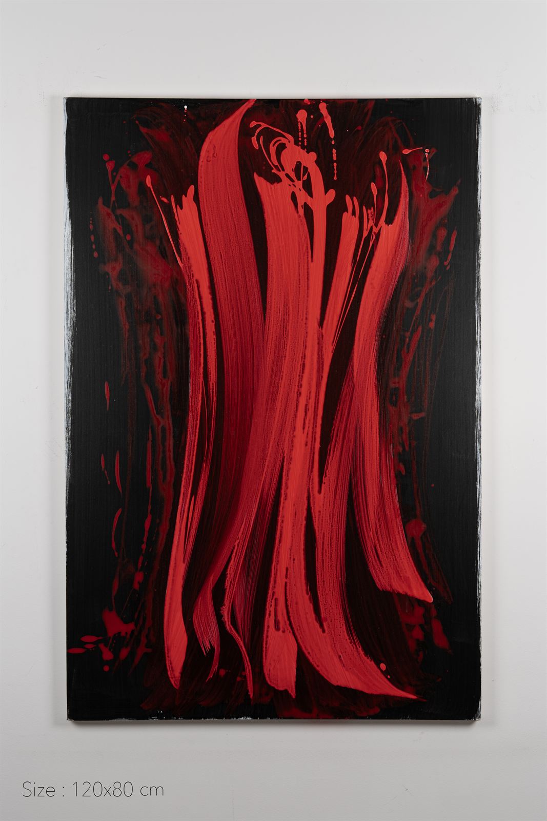 Long red strokes falling down a black canvas
